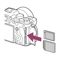Illustration showing how to insert memory cards into the camera