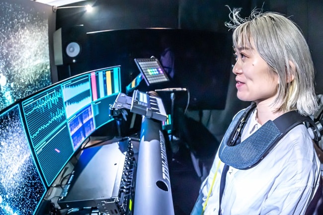 A person wearing a neck-worn device