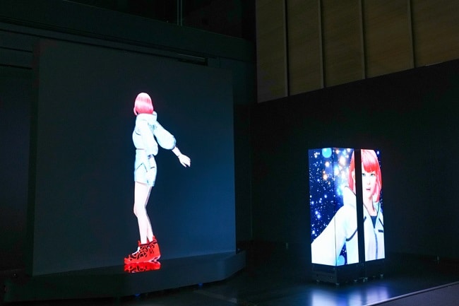 Three robots equipped with LED panels