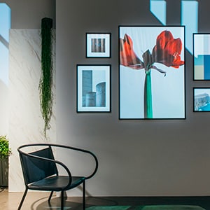 A living space in a windowless room with outside light shining through.